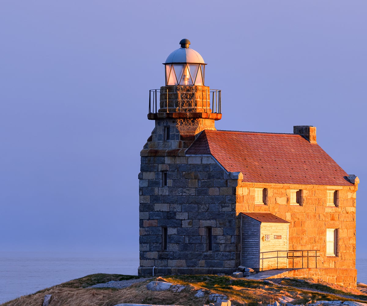 1,009 megapixels! A very high resolution, large-format VAST photo print of a seascape scene in Newfoundland, Canada with the Rose Blanche lighthouse illuminated by sunset on the rocks of the seashore; landscape photograph created by Scott Dimond.