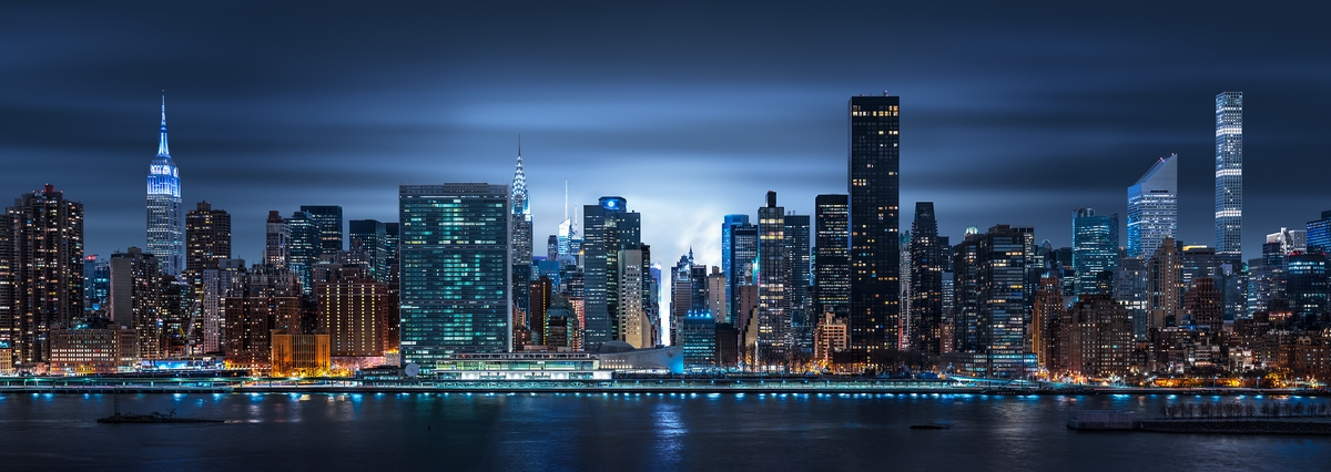 A very high resolution, large-format VAST photo print of the NYC skyline at night with the East River; cityscape photo created by Dan Piech.