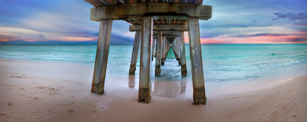 216 megapixels! A very high resolution photo of the beach and ocean under a pier; VAST photo created by Phil Crawshay in Naples Pier, Florida, USA.