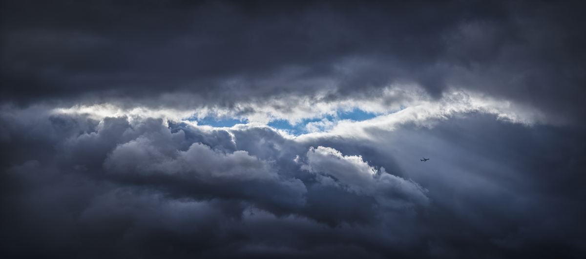 532 megapixels! A very high resolution, large-format VAST photo print of an epic cloud formation with a plane in the sky; photograph created by Dan Piech in New York City.