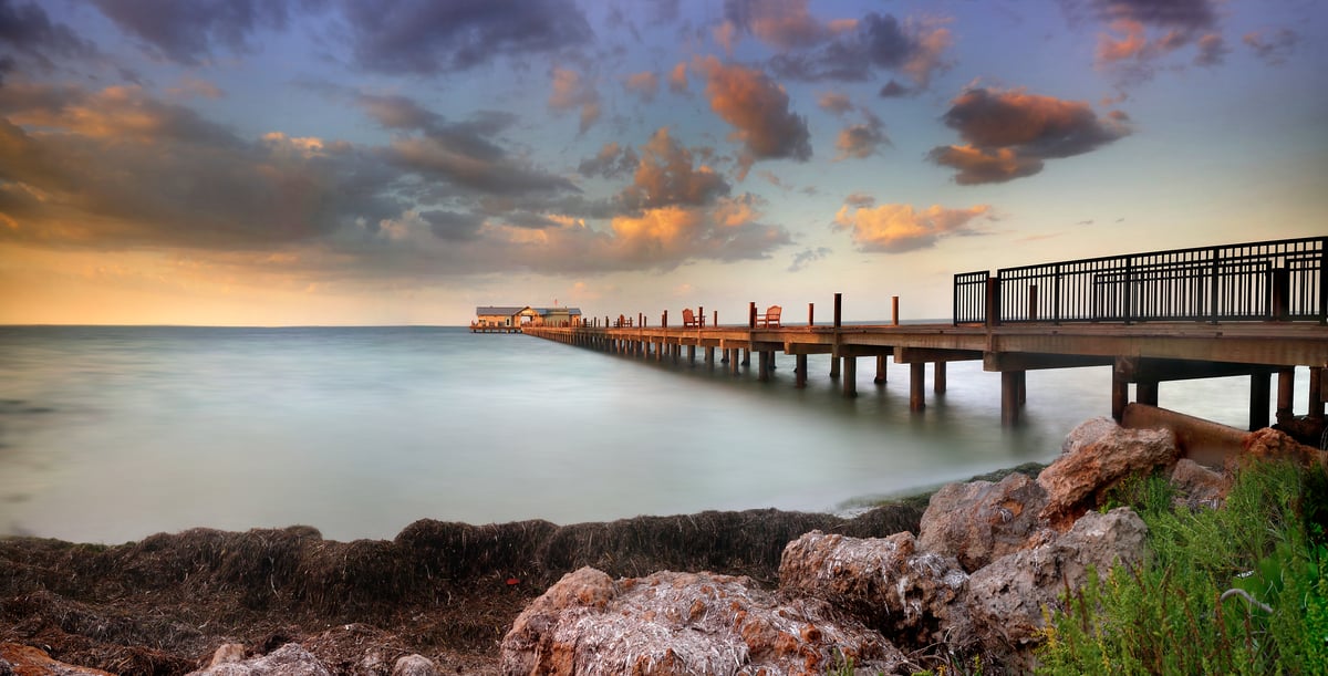 256 megapixels! A very high resolution, large-format VAST photo print of a pier going out into the water at sunset; photograph created by Phil Crawshay of City Pier in Bayfront Park, Anna Maria Island, Florida.