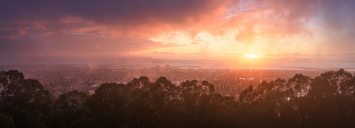 197 megapixels! A very high resolution, large-format VAST photo print of Berkeley, California with a storm clearing and the sun shining at sunset; cityscape photograph created by Jeff Lewis in Berkeley, California.