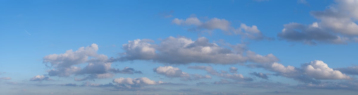 450 megapixels! A very high resolution, large-format VAST photo print of a blue sky with floating white puffy clouds; photograph created by Assaf Frank.